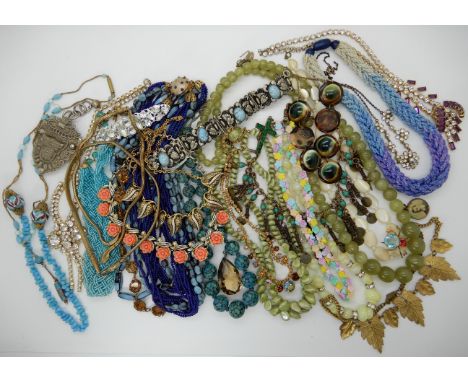 A collection of vintage costume jewellery to include, two snake necklaces, opericum shell necklace, smoky quartz pendant etc 