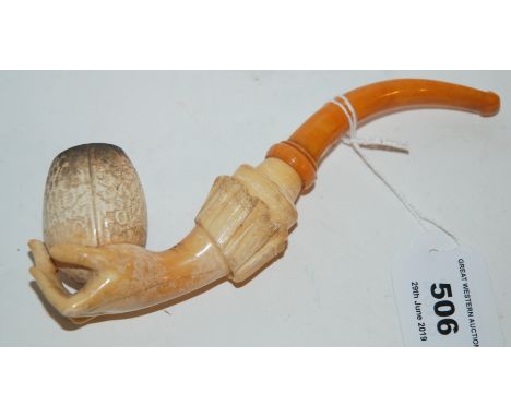 A carved Meerschaum pipe modelled as a hand in case, three other pipes Condition Report: Available upon request