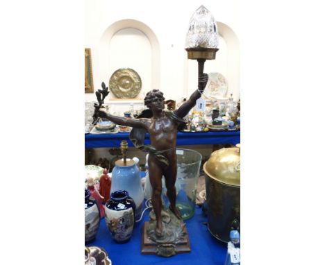 A French spelter figural lamp, modelled as a semi-naked man holding aloft a torch, entitled 'Primax', after Louis Moreaux, Sa