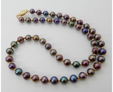 A string of Mikura black pearls with good lustre and an 18ct gold clasp and bead detail, each pearl approx 6- 6.7mm, length o