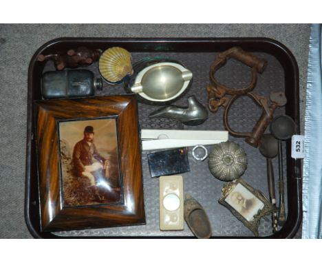 A tray lot including vintage hands cuffs, carved lion figure etc Condition Report: Available upon request