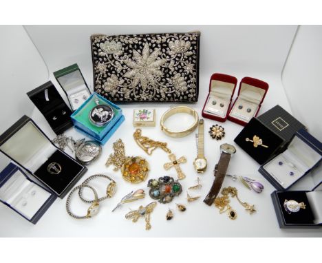 A collection of vintage costume jewellery to include a brooch by Miracle and an evening bag Condition Report: Not available f