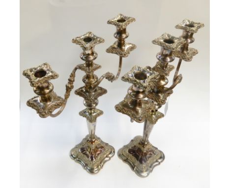 A pair of silver plated three-light candelabra, 46.5cm high Condition Report: Available upon request