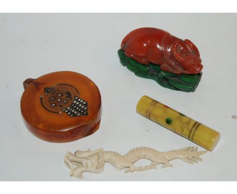 A Bakelite compact, carved buffalo, needle case etc Condition Report: Available upon request