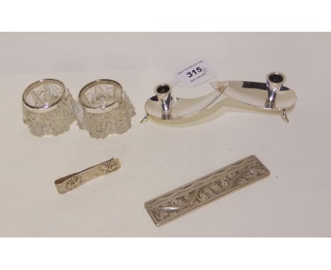 A lot comprising a Danish white metal candle holder, a pair of silver mounted glass salts, Birmingham marks, a white metal co