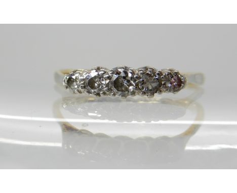 An 18ct gold and platinum five stone diamond ring of estimated approx 0.20cts combined diamond content, finger size N, weight