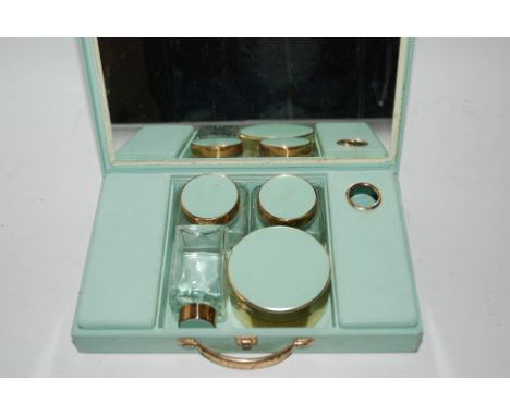 Four cased vintage travel sets Condition Report: Available upon request
