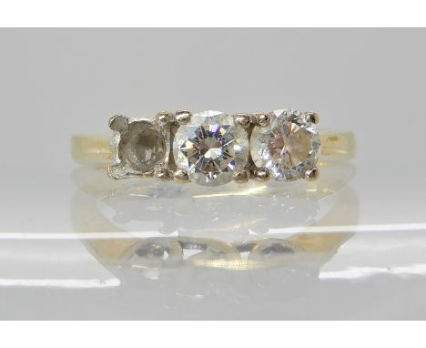 An 18ct gold three stone diamond ring (one diamond missing) two remaining diamonds estimated approx 0.62cts finger size N1/2,