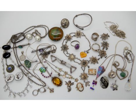 A collection of silver and costume jewellery to include, a spider's web necklace (needs tlc) a titanium and silver kite penda