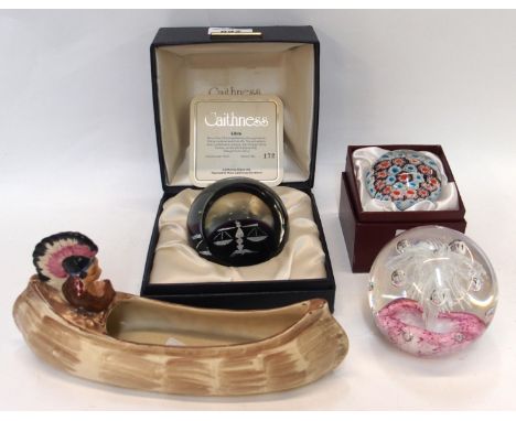 A Burleigh figure of an Indian in canoe, boxed Caithness paperweight Libra and two other paperweights (4) Condition Report: A
