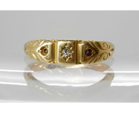 A 9ct gold ring set with a diamond and red gems (one red gem missing) size O1/2 Condition Report: Available upon request