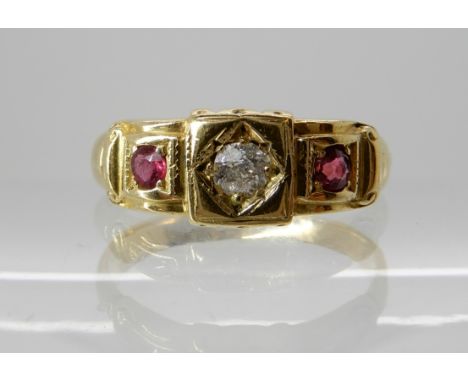 A bright yellow metal ring set with rubies and diamonds, finger size J approx. Weight 2.8gms Condition Report: Both rubies ha