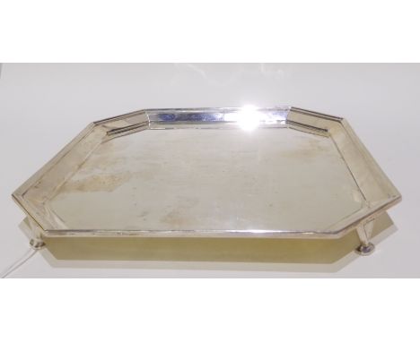 A silver salver by Harrison Brothers &amp; Howson (George Howson), Sheffield 1935, of square shape with canted corners on thr