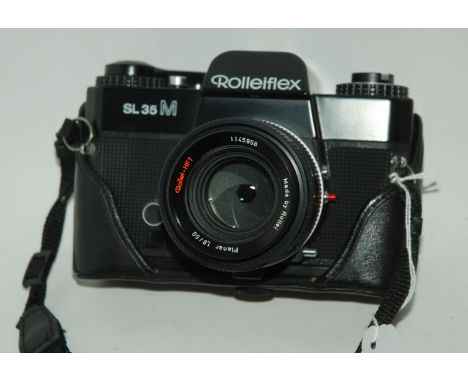 A Rolleiflex SL35M camera in case, Rollei 128BC flash in original box, light meter etc Condition Report: Available upon reque