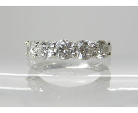 A platinum and diamond five stone ring of estimated approx 1ct, finger size F1/2, weight 4.7gms. Retailed by Mr Harold and So