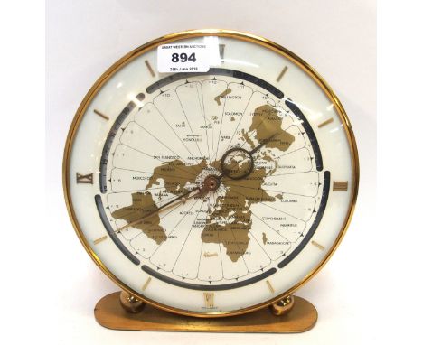 A Kundo circular gilt metal clock, the dial with map of the world, 25cm high Condition Report: Available upon request