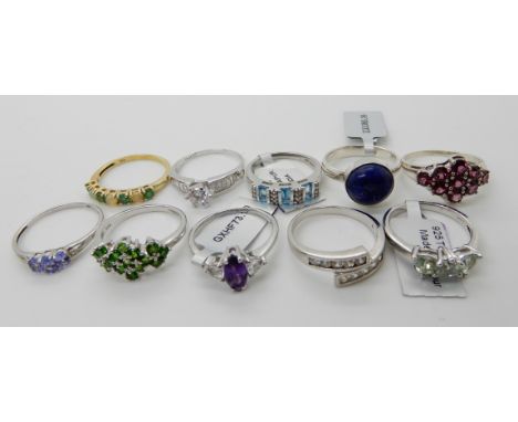 Ten silver rings set with gemstones to include, lapis lazuli, amethyst, opal and emerald some with tags Condition Report: Not