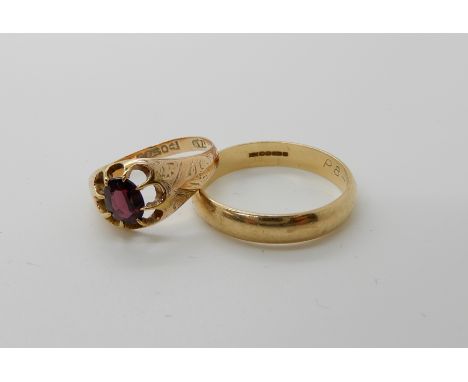 A 9ct gold garnet set ring size R and a gents 9ct gold wedding band size Z1/2, combined weight 6.4gms Condition Report: Avail