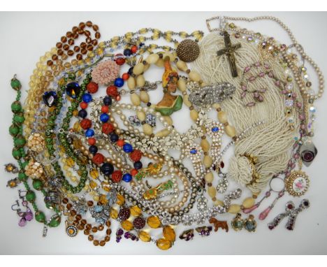 A collection of vintage costume jewellery to include, Cinnabar style beads, horn beads etc Condition Report: Not available fo