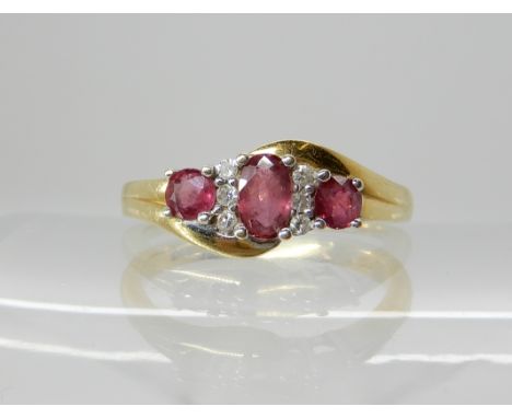 An 18ct gold ruby and diamond ring, central ruby approx 5mm x 3mm, finger size O1/2, weight 4.1gms Condition Report: Availabl