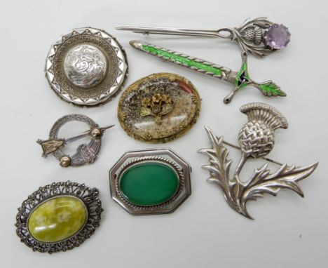 A silver and enamel sword brooch, a silver amethyst thistle brooch by Turnbull &amp; Easton, an Ortak silver and green agate 