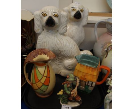 A pair of Staffordshire wally dugs, Myott &amp; Sons jug, Hancock's jug and a Friedel figure Condition Report: Available upon