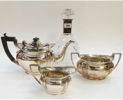 A lot comprising a silver plate mounted decanter and a three piece EP tea service (4) Condition Report: Available upon reques