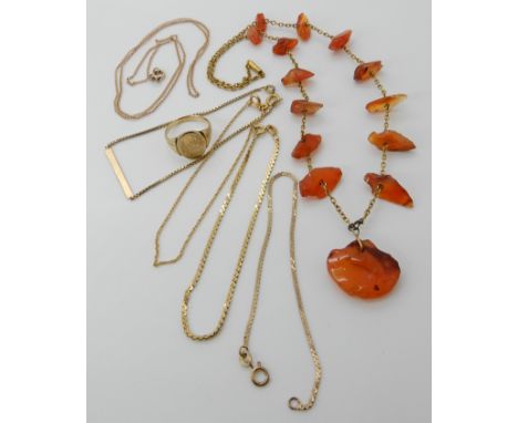 A 9ct gold mounted carnelian necklace, 41.5cm, weight 17.4gms, a bright yellow metal heraldic engraved signet ring, size O1/2