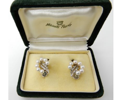 A pair of silver Mikimoto pearl earrings with screw fitting. Original box Condition Report: Light general wear. 