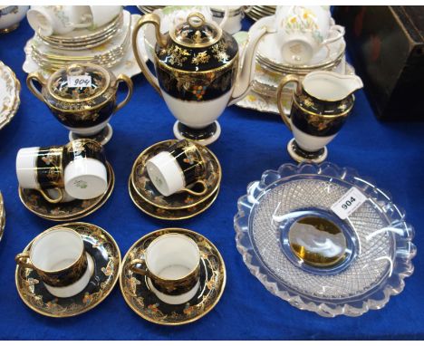 An Aynsley coffee set, the black ground with gilt and coloured enamel decoration and a pair of Bohemian glass plates Conditio