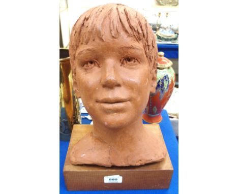 A terracotta portrait bust of a boy, on wooden stand, 39cm high including stand, (def) Condition Report: Available upon reque