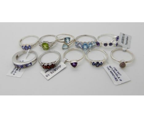 Ten silver rings set with gemstones to include, amethyst, peridot and tourmaline, some with tags Condition Report: Not availa