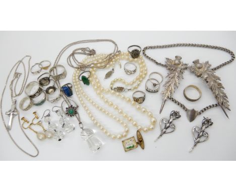 Silver and white metal jewellery to include, a white metal thistle shaped cloak clasp, a rock crystal carved thistle pendant 