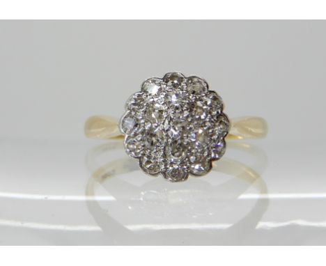 An 18ct gold and platinum vintage diamond cluster ring of estimated approx combined diamond weight 0.50cts, finger size N, we