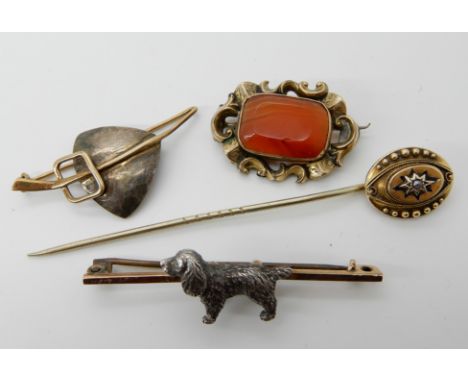 A white and yellow metal dog brooch, stamped 9ct to yellow bar brooch, a pearl set yellow metal pin and two further brooches,