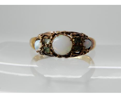 A 15ct gold opal and green gem set ring, size N, weight 2gms Condition Report: One opal badly chipped will need replacing, th
