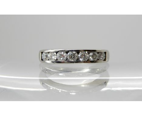 A platinum seven stone diamond ring of estimated approx 0.60cts, finger size J1/2, weight 3.1gms Condition Report: very light