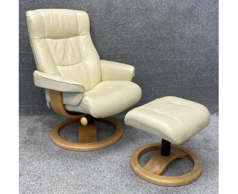 A contemporary limewashed bent ply and leather upholstered reclining chair and matching footstool. H.99 W.74 D.78cm (largest)