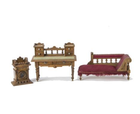 German oak  Dolls' House Furniture, desk with two large and four small drawers --6in. (15cm.) wide; chaise lounge with red up