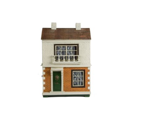 A Triangtois Size B  Dolls' House,  with cream-painted rough-cast façade upper, brick-paper lower, green front door with lion