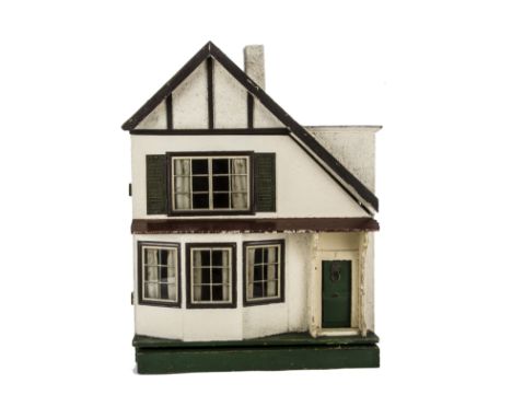 A Tri-ang A symmetrical Wooden Size D  Dolls' House, rough-cast façade, timbered gable, green front door with lion head knock