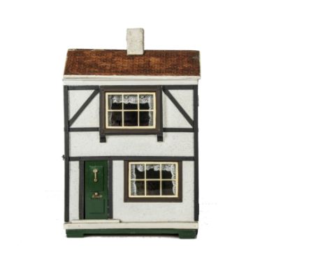 A Triangtois Size A  Dolls' House circa 1924,  with timbered and rough-cast façade, green front door with knocker and 'Letter