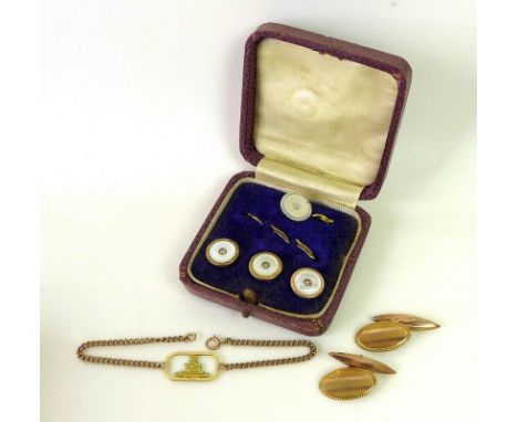 A pair of 9ct rose gold cufflinks, oval engine turned fronts with torpedo shaped back, hallmarked, 5.4g, together with a 9ct 