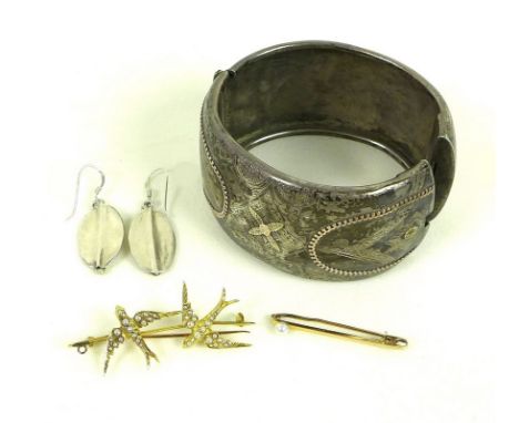 A 15ct gold brooch modelled as two swallows in flight, each set with seed pearls, marked 15ct, 4.6g, together with a 15ct gol