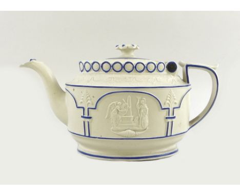 An early 19th century white stoneware teapot, moulded in relief with opposing panels of classical figures highlighted in blue