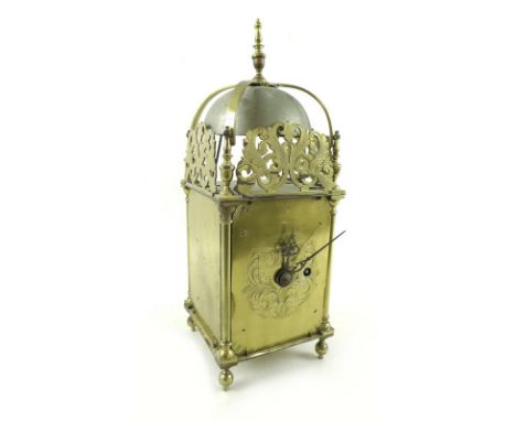 An Edwardian brass lantern clock, in 17th century style, with arched dome and turned finial, pierced and foliate engraved fre