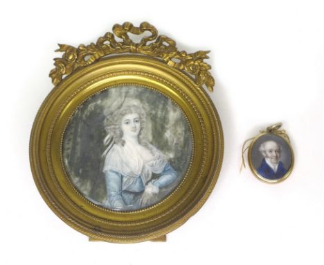 A late 18th century circular portrait miniature of a lady, indistinctly inscribed to back, within gilded brass frame, 10.5 by