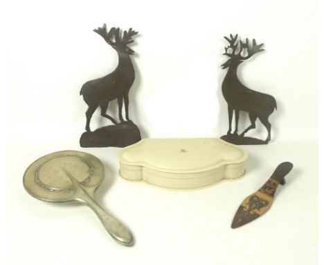 A bakelite dressing table set of a faux ivory, the cartouche shaped travelling case, 27.3 by 14 by 4.5cm, containing full man