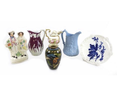 A collection of mostly 19th century ceramics including a milk jug, the body painted with band of pink roses surrounded by gil