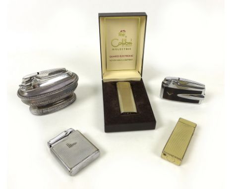 A collection lighters including a gold plated Dunhill lighter, the body with engine turned diamond detailing, the base marked